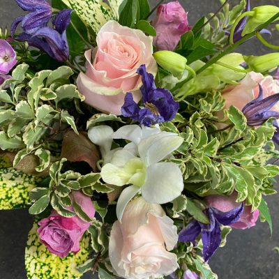 Pastel Serenity Bouquet - A soothing and delicate arrangement in soft pastels, with hints of purple and pink, creating a calming and peaceful ambiance.