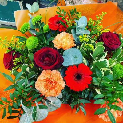 Radiant Sunshine Bouquet - A bright and cheerful arrangement with vivid oranges, sunny yellows, and lively greens, perfect for bringing warmth and happiness.