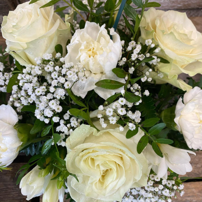 Pure Elegance Arrangement - A serene and elegant all-white arrangement with roses and delicate filler flowers.