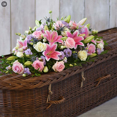 Rose and Eryngium Casket Spray - One of our most popular designs, this casket spray is a profusion of pastel blooms including pink and ivory roses and pink oriental lilies.

Approximate Product Dimensions:
Standard:
Length: 90cm, Width: 40cm, Height: 30cm.

Large:
Length: 120cm, Width: 40cm, Height: 30cm.

Extra large:
Length: 155cm, Width: 45cm, Height: 30cm.