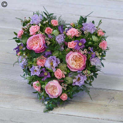 Cottage Garden Heart - Featuring stunning garden roses, delicate lilac lisianthus and scented rosemary, this heart tribute is full of beautiful tones. 

Approximate Product Dimensions:

Length: 38cm, Width: 38cm, Height: 15cm.