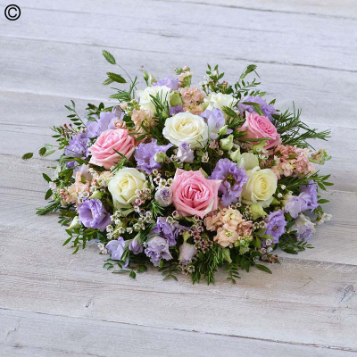 Pretty Pastel Posy - A profusion of soft pastel shades, this posy features stunning roses plus fragrant freesias and pretty scented stocks.

Approximate Product Dimensions:
Width: 38cm, Height: 15cm.