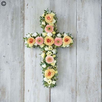 Pastel Cross - A cross of pretty pastels including peach roses and germini, white carnations and cream lisianthus.

Approximate Product Dimensions:
Standard:
Length: 60cm.

Large:
Length: 90cm.

Extra large:
Length: 120cm.