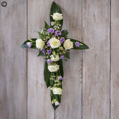 Lilac and White Cross - A beautiful lilac and white cross featuring roses, lisianthus and eucalyptus. 

Approximate Product Dimensions:

Length: 76cm, Width: 46cm, Height: 19cm.