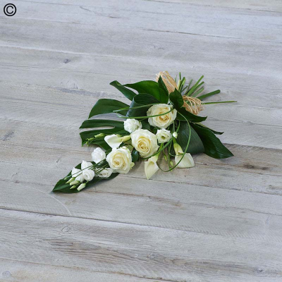 White Rose and Calla Lily Sheaf - Graceful calla lilies meet large headed roses and rich green foliage in an elegant, neutral design.

Approximate Product Dimensions:
Standard:
Length: 60cm, Width: 30cm, Height: 15cm.

Large:
Length: 70cm, Width: 40cm, Height: 15cm.

Extra large:
Length: 75cm, Width: 45cm, Height: 15cm.