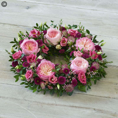 Garden Rose Wreath - A beautiful wreath of pink tones featuring stunning garden roses, delicate astrantia and elegant foliage.

Approximate Product Dimensions:

Standard:
Width 34cm. Height 12cm.

Large:
Width 38cm. Height 14cm.

Extra large:
Width 48cm. Height 14cm.