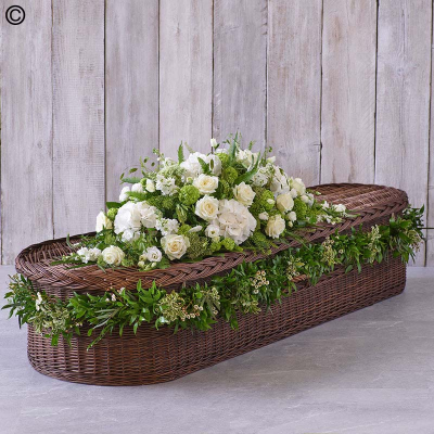 Large White Casket Spray with Garland - Elegant White Casket Spray: Premium roses, stocks, and hydrangeas, adorned with a lush foliage garland and delicate waxflower."