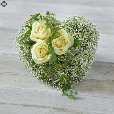 Heart Ddornment - "green," "white," "gypsophila," and "ivory roses" are used naturally.