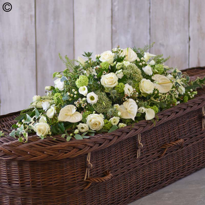 bb - Elegant Green and White Casket Spray: Premium roses, cala lilies, anthuriums, and viburnum opulus."